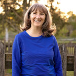 Terry Caldwell smiling with the sunshine in the background.